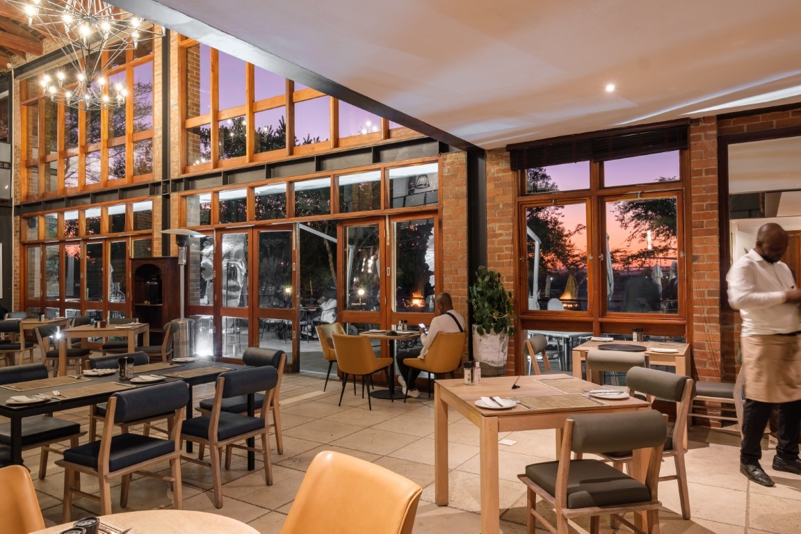 The light-filled Riboville restaurant at sunset